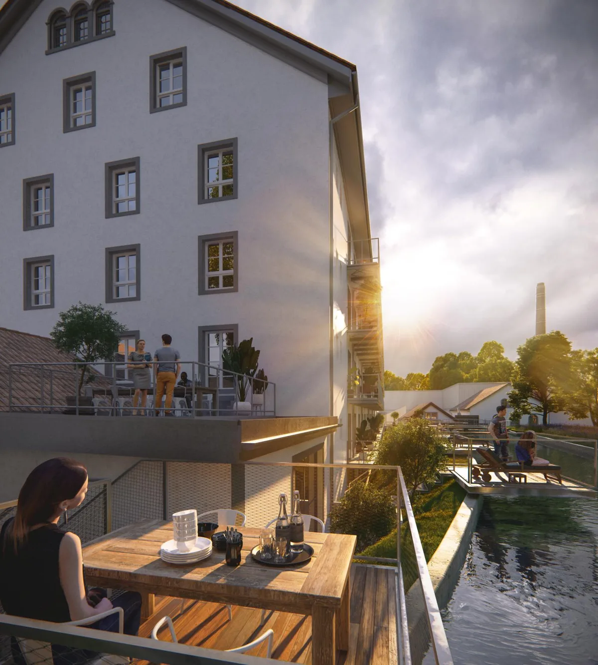 Die geplanten Wohnungen in der alten Spinnerei erhalten private Terrassen mit Blick ins Grüne., Die Eigentümerin plant, dass im Gebäude dereinst 100 Personen leben können., Die 35 Wohnungen werden als Dachwohnungen …, … Lofts …, … oder Townhouses gestaltet., Die Balkone werden das Bild des Gebäudes verändern.