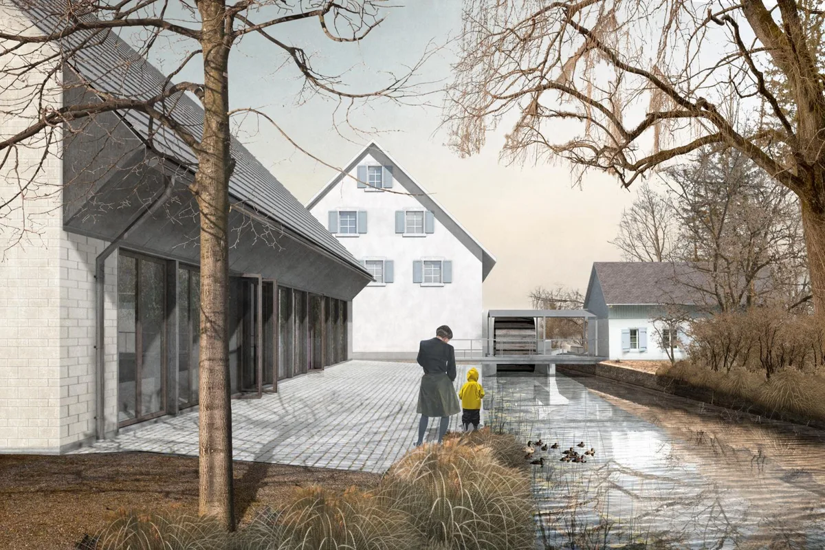 Der Neubau (links) soll gleich neben dem historischen Ensemble Obere Mühle (Mitte) und Senfmühle (rechts) zu stehen kommen., Das Erscheinungsbild des Gebäudes sei «Geschmacksache», war in der Debatte wiederholt zu hören., Blumiger Empfang für die Ratsmitglieder im katholischen Pfarreizentrum Leepünt., Fast wie an einer Gemeindeversammlung: Das zahlreiche Publikum verfolgt gespannt den Verlauf der Ratssitzung.