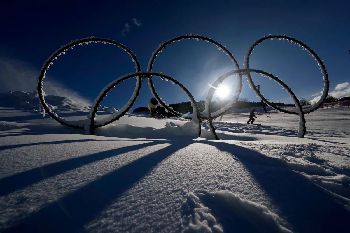 Olympic rings are seen in the snow at the Stelvio Ski Center, venue for the alpine ski and ski mountaineering disciplines at the Milan Cortina 2026 Winter Olympics, in Bormio, Italy, Thursday, Jan. 16, 2025. (AP Photo/Luca Bruno)