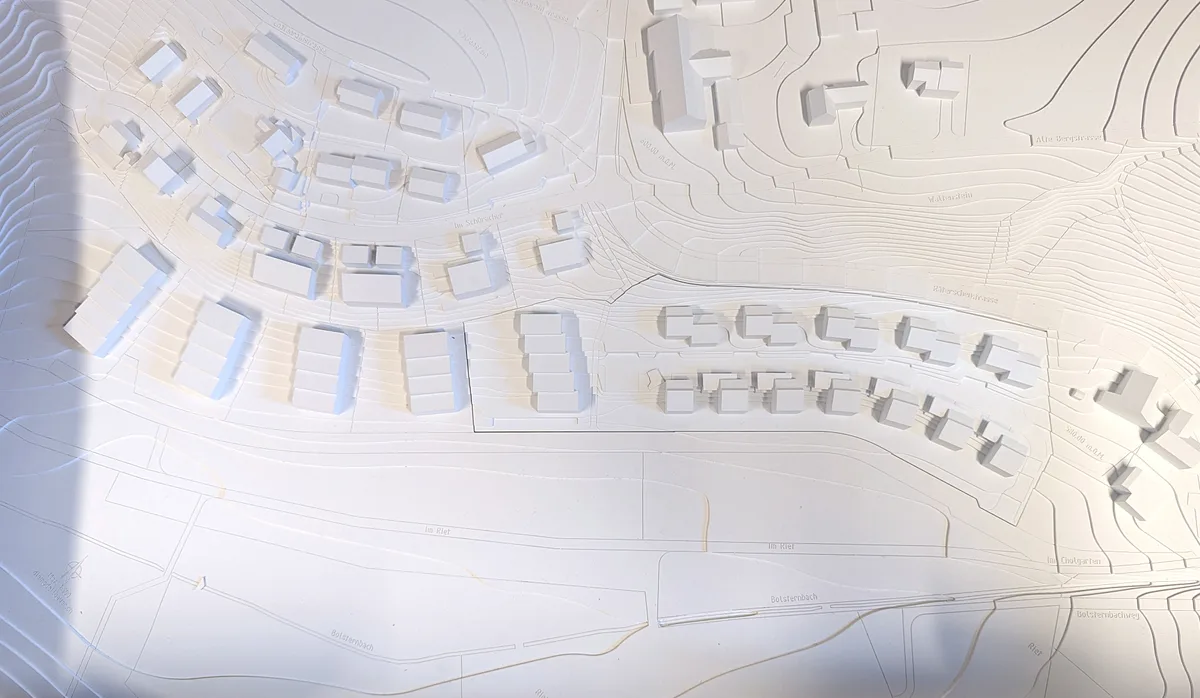 Man sieht ein 3-D-Modell eines Neubauprojekts.