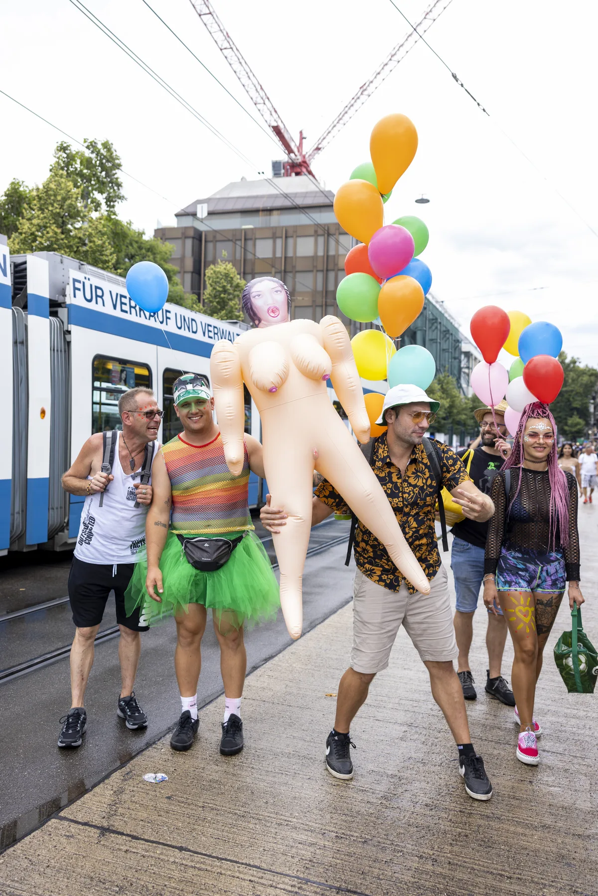 Participants with a Rubber doll during the 30th Street Parade in the city center of Zurich, Switzerland, Saturday, August 12, 2023. The annual dance music event Street Parade runs this year under the claim