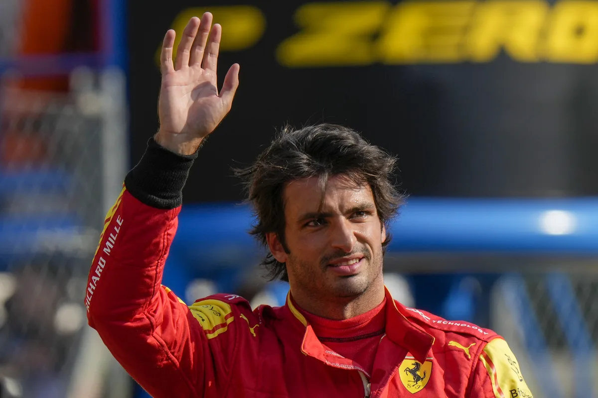Ferrari driver Carlos Sainz of Spain celebrates his pole position after the qualifying session ahead of Sunday's Formula One Italian Grand Prix auto race, at the Monza racetrack, in Monza, Italy, Saturday, Sept. 2, 2023. (AP Photo/Luca Bruno)