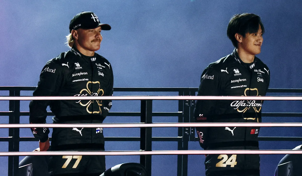 epa10977640 Team Alfa Romeo F1's Zhou Guanyu (R) and Valtteri Bottas (L) attend the opening ceremony ahead of the F1 Grand Prix of Las Vegas at the Las Vegas Strip Circuit in Las Vegas, Nevada, USA, 15 November 2023.  EPA/ETIENNE LAURENT