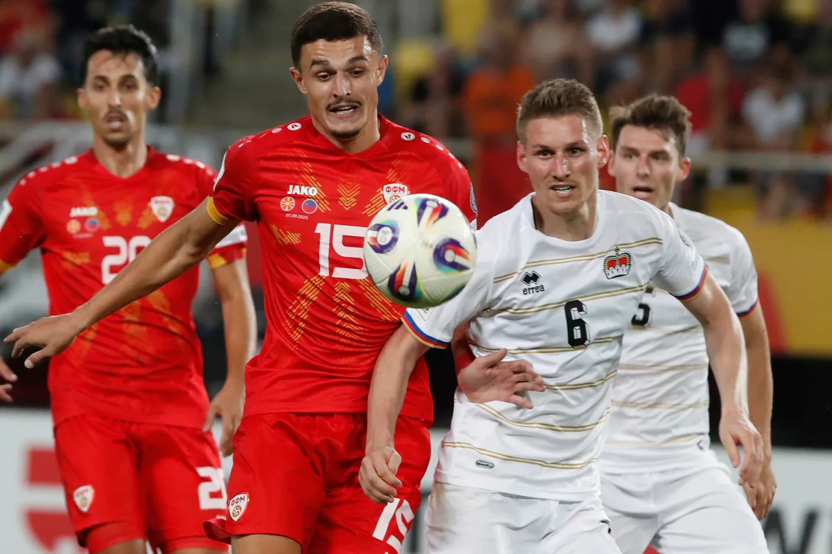 North Macedonia's Elmin Rastoder, left, and Liechtenstein's Andreas Malin, right, fight for the ball during a World Cup qualifying soccer match between North Macedonia and Liechtenstein at National Arena Todor Proeski in Skopje, Sunday, Sept. 7, 2025. (AP Photo/Boris Grdanoski)